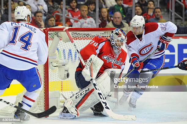 Washington Capitals goalie Braden Holtby makes a save on a shot by Montreal Canadiens center Brian Flynn in the second period on December 17 at the...