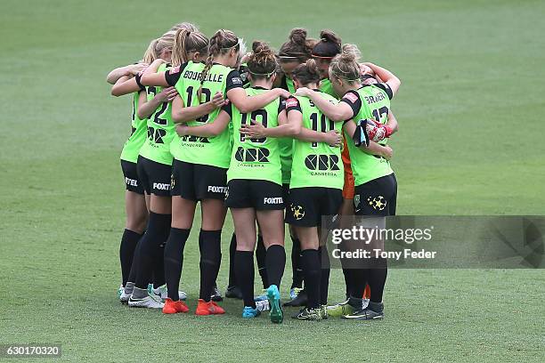 Canberra players form a team huddle during the round seven W-League match between Canberra and Brisbane at Central Coast Stadium on December 18, 2016...