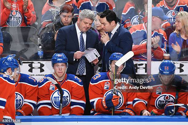 Todd McLellan and Jay Woodcroft of the Edmonton Oilers are selecting player for the shootout during the game against the Tampa Bay Lightning on...