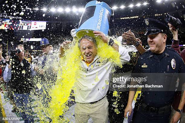 Head coach Jay Hopson of the Southern Miss Golden Eagles is dunked with Powerade after a game at the Mercedes-Benz Superdome on December 17, 2016 in...