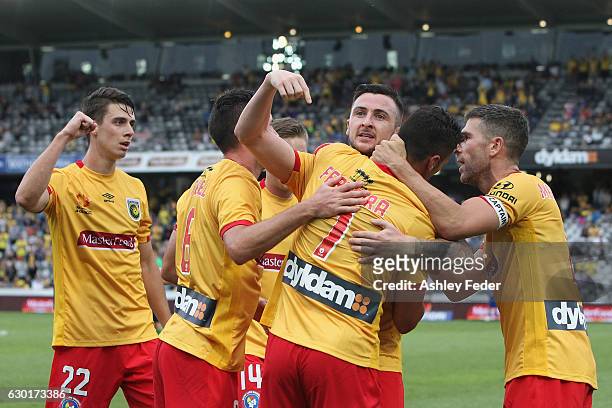 Roy O'Donovan of the Mariners celebrates his goal with team mates during the round 11 A-League match between the Central Coast Mariners and Brisbane...