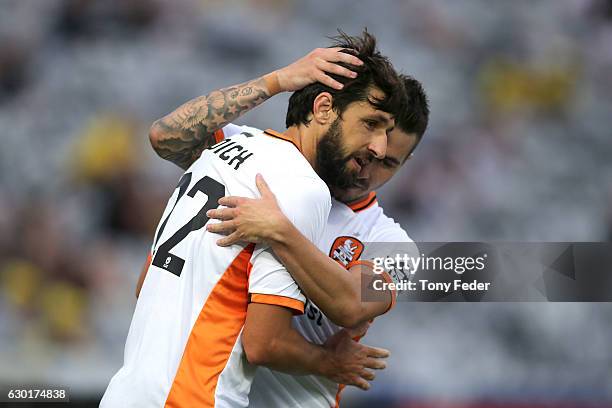 Jamie Maclaren and Thomas Broich of the Roar celebrate a goal during the round 11 A-League match between the Central Coast Mariners and Brisbane Roar...