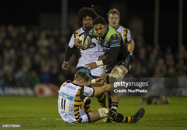 Bundee Aki of Connacht tackled by Josh Bassett of Wasps during the European Rugby Champions Cup Round 4 match between Connacht Rugby and Wasps at the...