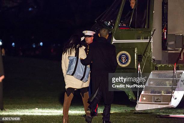 President Barack Obama and his daughter Sasha depart the White House before boarding Marine One on the South Lawn December 16, 2016 in Washington,...