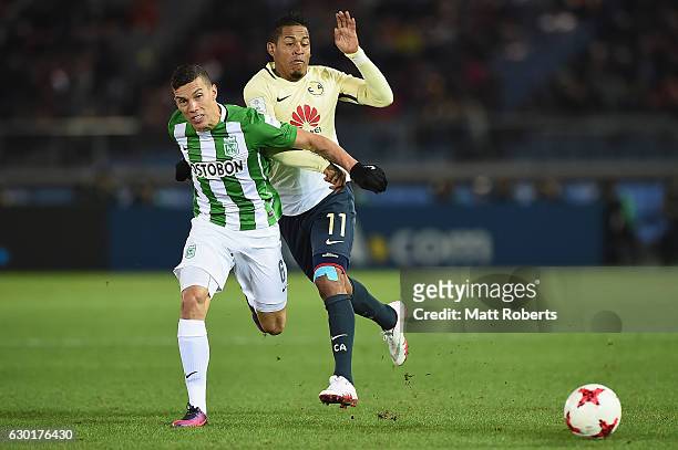 Matheus Uribe of Atletico Nacional competes for the ball against Michael Arroyo of Club America during the FIFA Club World Cup 3rd place match...