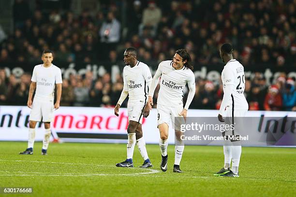 Blaise Matuidi, Edinson Cavani and Jean Kevin Augustin of Paris Saint Germain looks dejected during the French Ligue 1 match between Guingamp and...