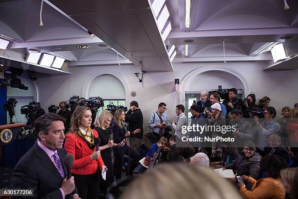 Packed room of journalists await President Barack Obama, who was coming to give his last press briefing and answer questions from reporters, in the...