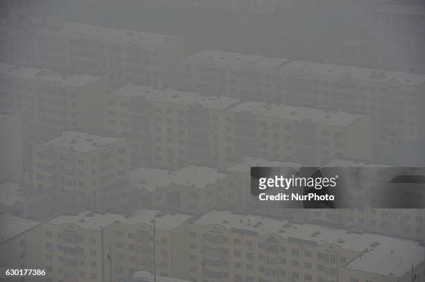 Photo taken from the Dragon tower,a supertall skyscraper under construction at the Nangang district, shows the city being shrouded in heavy smog on...