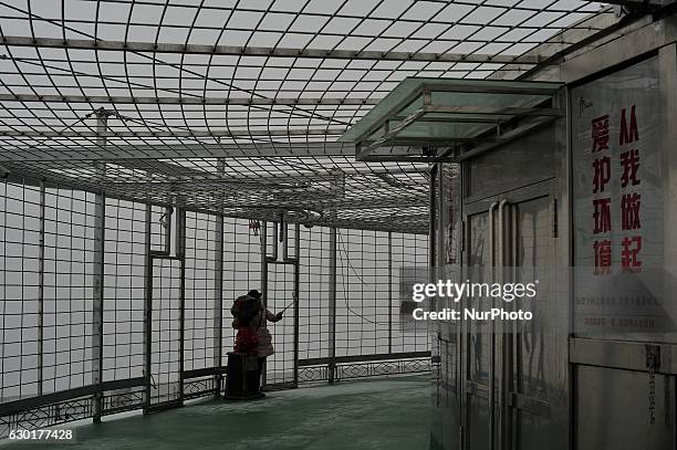 Photo taken from the Dragon tower,a supertall skyscraper under construction at the Nangang district, shows the city being shrouded in heavy smog on...