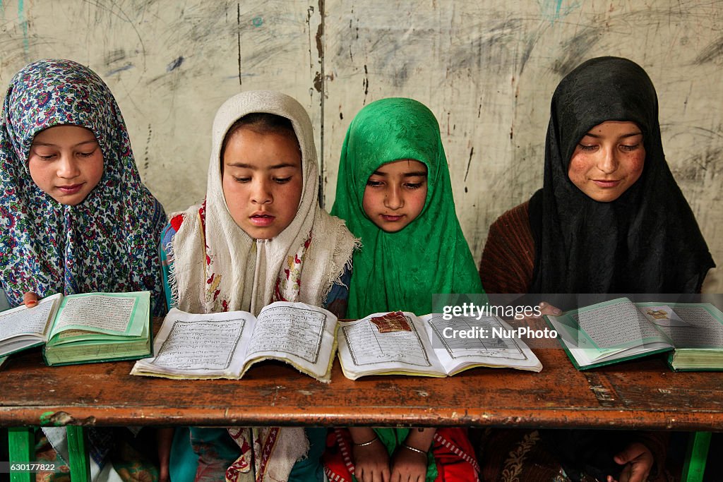 Muslim children study the Quran at a Islamic school