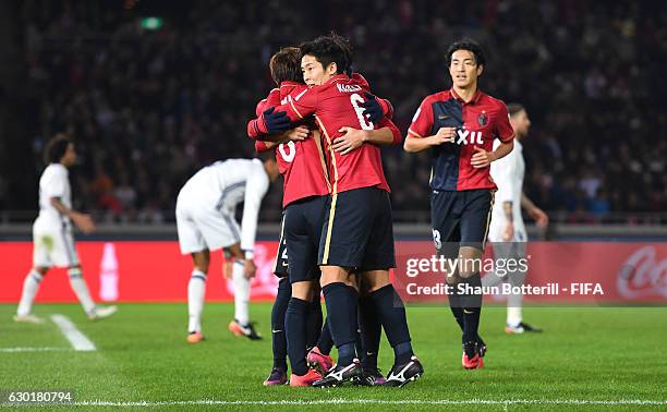 Gaku Shibasaki of Kashima Antlers celebrates with team mates after he scores his sides first goal during the FIFA Club World Cup Final match between...
