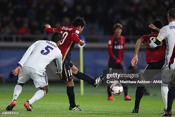 Gaku Shibasaki of Kashima Antlers scores his team's first goal to make the score 1-1 during the FIFA Club World Cup final match between Real Madrid...