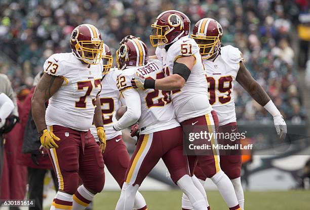 Cullen Jenkins, Deshazor Everett, Will Compton, and Ricky Jean Francois of the Washington Redskins celebrate against the Philadelphia Eagles at...