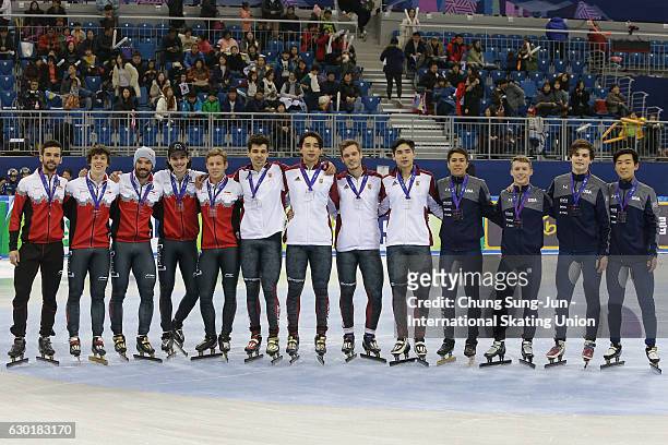 Silver medalists team Canada, gold medalists team Hungary and bronze medalists team United States celebrate during the victory ceremony for the Men...