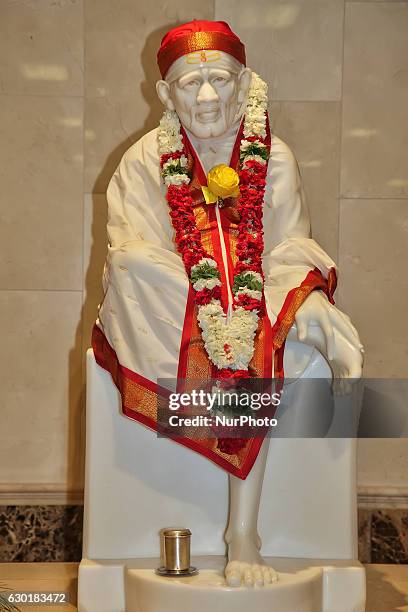 Marble statue of Sai Baba in the main hall of the Sri Sathya Sai Baba Centre in Scarborough, Ontario, Canada.