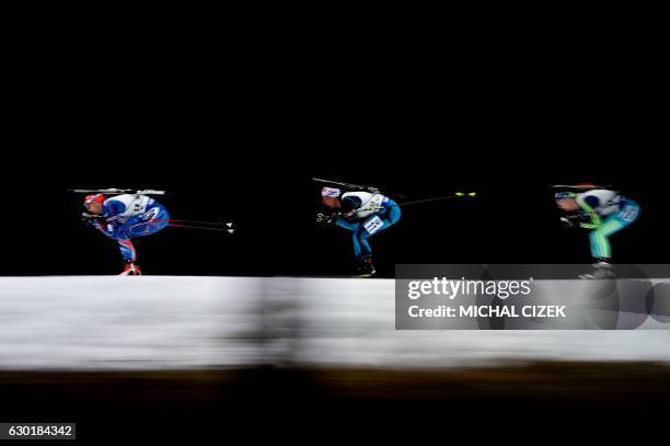 Ondrej Moravec of Czech Republic, Quentin Fillon Maillet of France and Dmytro Pidruchnyi of Ukraine compete during Men 15 Km mass start competition,...