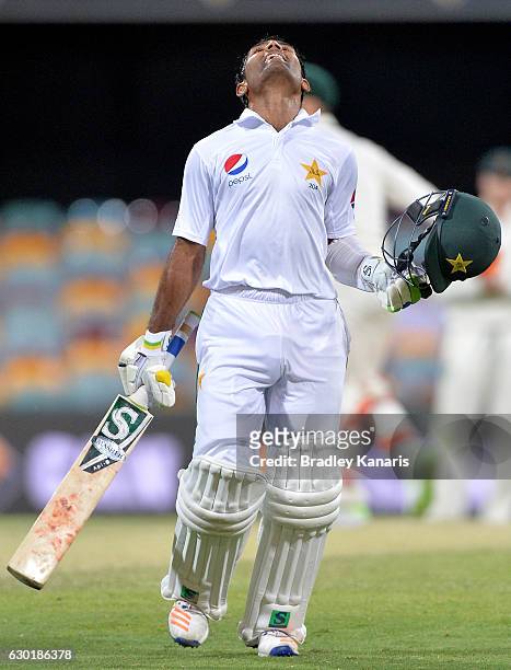 Asad Shafiq of Pakistan celebrates after scoring a century during day four of the First Test match between Australia and Pakistan at The Gabba on...