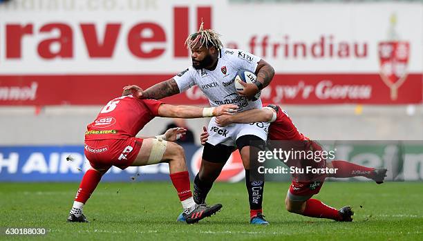 Toulon centre Mathieu Bastareaud makes a break during the European Rugby Champions Cup match between Scarlets and RC Toulonnais at Parc Y Scarlets on...