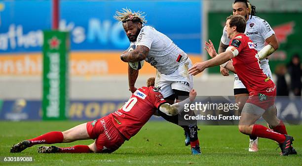 Toulon centre Mathieu Bastareaud is tackled by Rhys Patchell during the European Rugby Champions Cup match between Scarlets and RC Toulonnais at Parc...