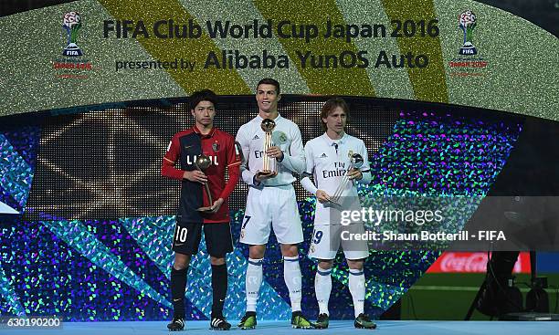 Goldon boot winner Cristiano Ronaldo of Real Madrid and 2nd place Luka Modric of Real Madrid and 3rd place Gaku Shibasaki of Kashima Antlers pose for...