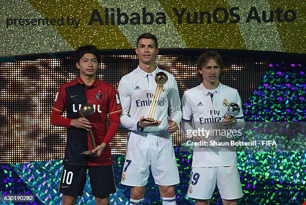 Goldon boot winner Cristiano Ronaldo of Real Madrid and 2nd place Luka Modric of Real Madrid and 3rd place Gaku Shibasaki of Kashima Antlers pose for...
