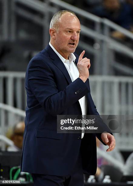 Head coach Thad Matta of the Ohio State Buckeyes signals his players as they take on the UCLA Bruins during the CBS Sports Classic at T-Mobile Arena...