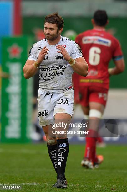 Toulon fullback Leigh Halfpenny reacts after his last minute penalty kick misses during the European Rugby Champions Cup match between Scarlets and...