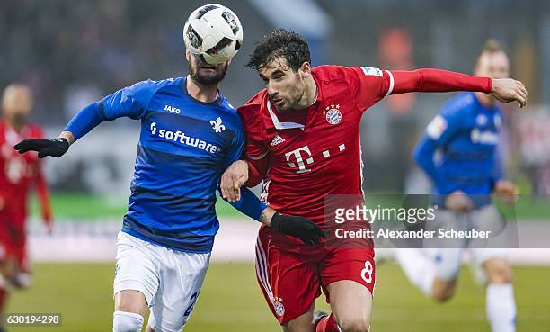 Marcel Heller of Darmstadt challenges Javi Martinez of Bayern Muenchen during to the Bundesliga match between SV Darmstadt 98 and Bayern Muenchen at...