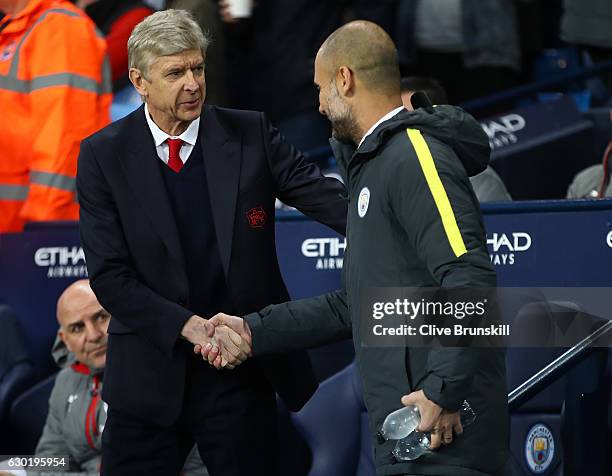 Arsene Wenger, Manager of Arsenal and Josep Guardiola, Manager of Manchester City shake hands prior to kick off during the Premier League match...