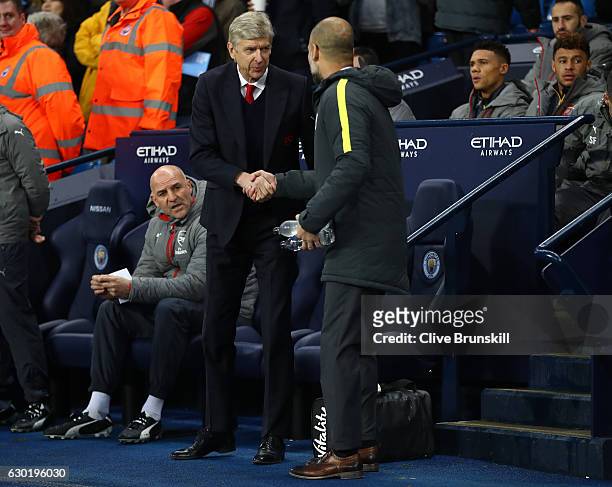 Arsene Wenger, Manager of Arsenal and Josep Guardiola, Manager of Manchester City shake hands prior to kick off during the Premier League match...