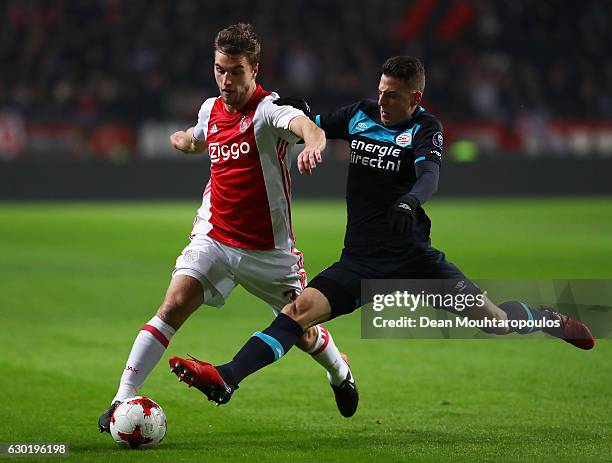 Joel Veltman of Ajax battles for the ball with Santiago Arias of PSV during the Eredivisie match between Ajax Amsterdam and PSV Eindhoven held at...