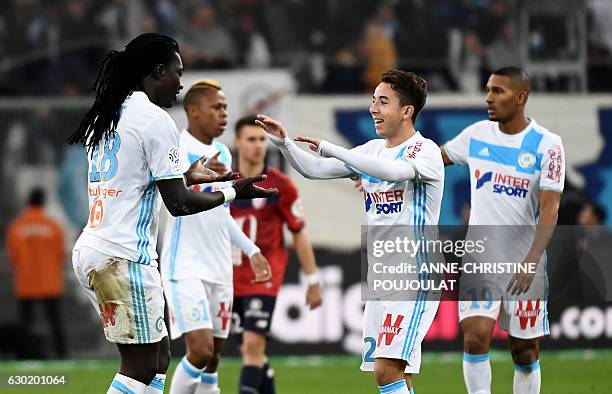 Olympique de Marseille's French forward Bafetimbi Gomis celebrates with Olympique de Marseille's French midfielder Maxime Lopez after scoring during...