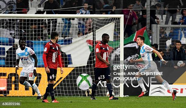 Olympique de Marseille's French midfielder Florian Thauvin celebrates after scoring during the French L1 football match Marseille vs Lille on...