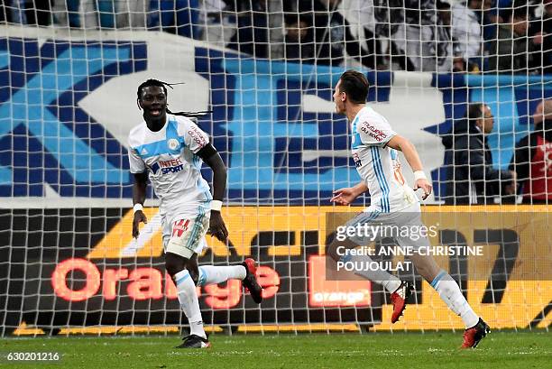 Olympique de Marseille's French midfielder Florian Thauvin celebrates with Olympique de Marseille's French forward Bafetimbi Gomis after scoring...