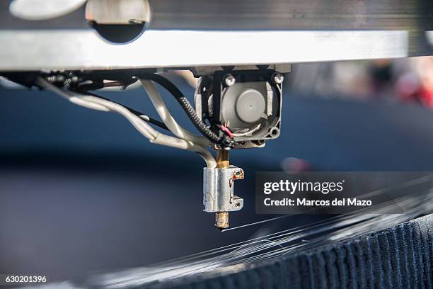 Detail of a 3D large printer making a copy of Star Wars Death Star coinciding with the release of Rogue One film.