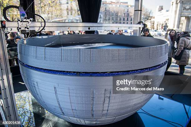 Large printer making a copy of Star Wars Death Star coinciding with the release of Rogue One film.