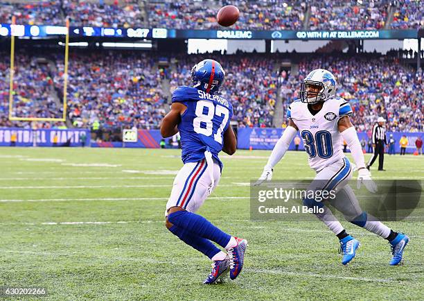 Sterling Shepard of the New York Giants makes a catch to score a touchdown against Asa Jackson of the Detroit Lions in the first quarter at MetLife...