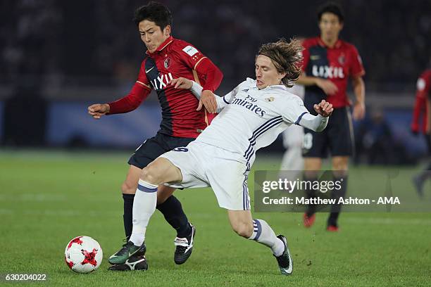 Shoma Doi of Kashima Antlers and Luka Modric of Real Madrid during the FIFA Club World Cup final match between Real Madrid and Kashima Antlers at...