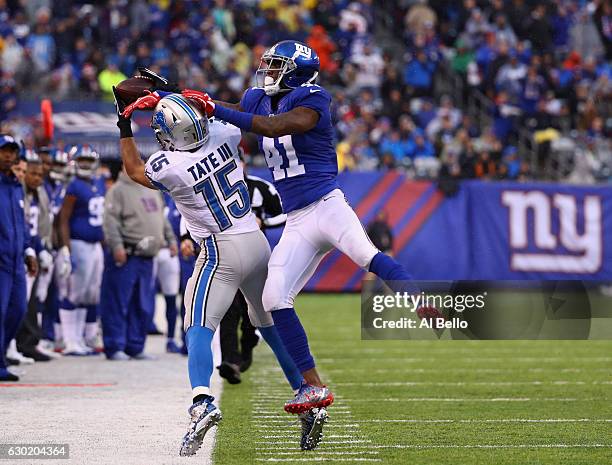 Golden Tate of the Detroit Lions attempts to make a catch against Dominique Rodgers-Cromartie of the New York Giants in the second quarter at MetLife...