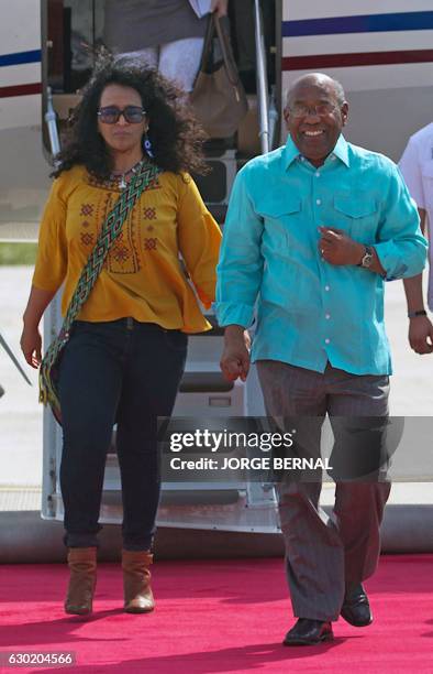 Venezuela's Vice President Aristobulo Isturiz walks next to Venezuelan ambassador to Bolivia, Crisbeyle Hernandez upon his arrival at the Chimore...