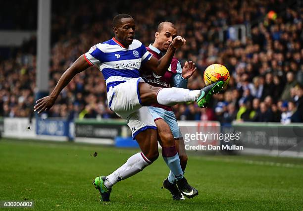Nedum Onuoha of Queens Park Rangers battles for the ball with Gabriel Agbonlahor of Aston Villa during the Sky Bet Championship match between Queens...