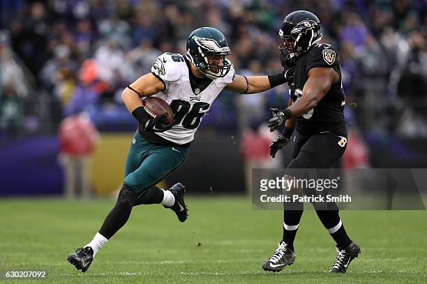 Tight end Zach Ertz of the Philadelphia Eagles carries the ball against outside linebacker Albert McClellan of the Baltimore Ravens in the second...