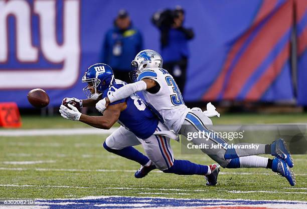 Asa Jackson of the Detroit Lions breaks up a pass for Sterling Shepard of the New York Giants in the fourh quarter at MetLife Stadium on December 18,...