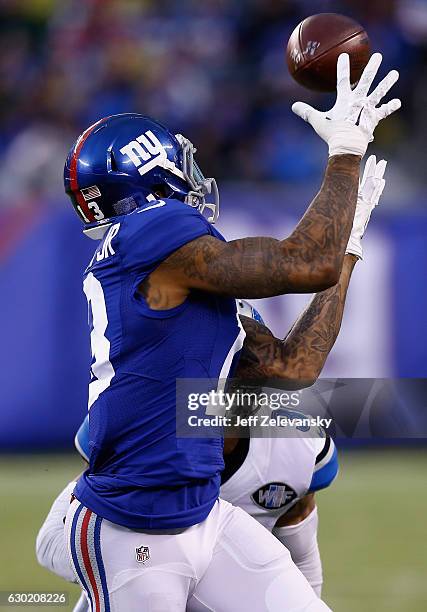 Odell Beckham Jr. #13 of the New York Giants pulls in a pass alongside Asa Jackson of the Detroit Lions in the second half at MetLife Stadium on...