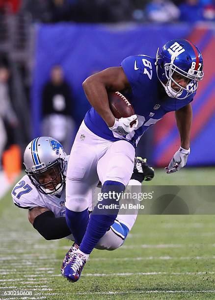 Sterling Shepard of the New York Giants evades a tackle by Glover Quin of the Detroit Lions in the second half at MetLife Stadium on December 18,...