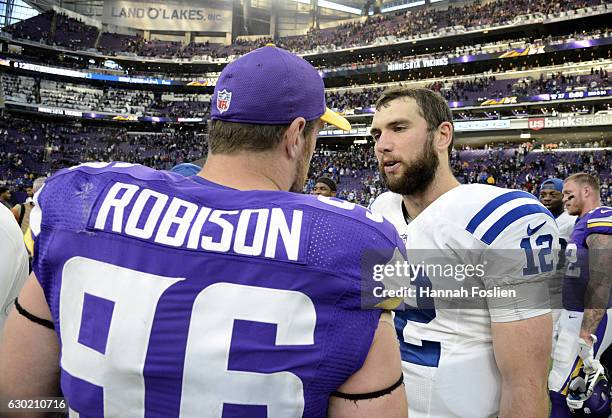 Brian Robison of the Minnesota Vikings and Andrew Luck of the Indianapolis Colts greet each other after the game on December 18, 2016 at US Bank...