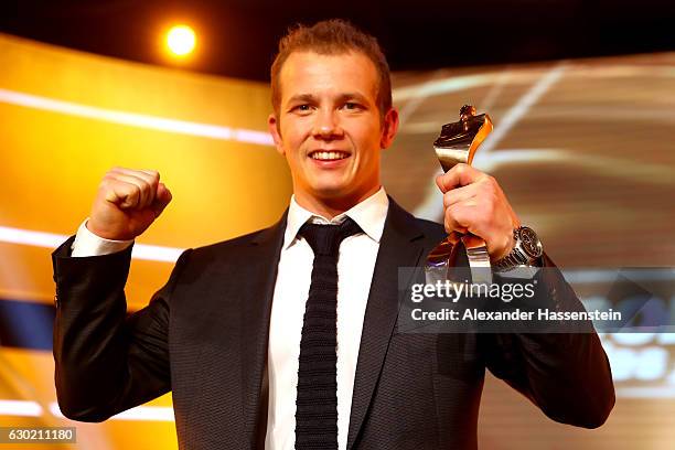 Fabian Hambuechen poses with his Sportler des Jahres 2016 award during the Sportler des Jahres 2016 gala at Kurhaus Baden-Baden on December 18, 2016...