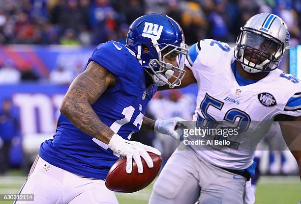 Odell Beckham Jr. #13 of the New York Giants carries the ball against Antwione Williams of the Detroit Lions in the second half at MetLife Stadium on...