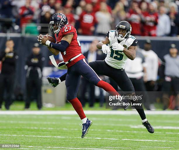 Quintin Demps of the Houston Texans intercepts a pass intended for Allen Robinson of the Jacksonville Jaguars in the fourth quarter at NRG Stadium on...