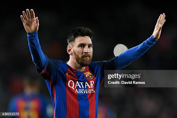 Lionel Messi of FC Barcelona celebrates after scoring his team's fourth goal during the La Liga match between FC Barcelona and RCD Espanyol at the...